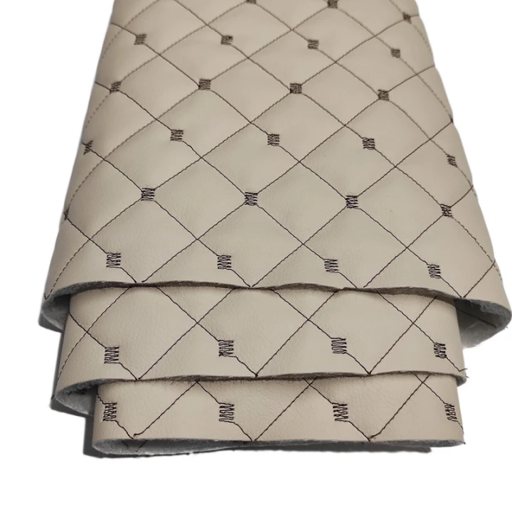 cuir-ecologique-mix-3x3-cm-couleur-beige-cousu-avec-des-fils-marron-metrage-145-cm-222.jpg