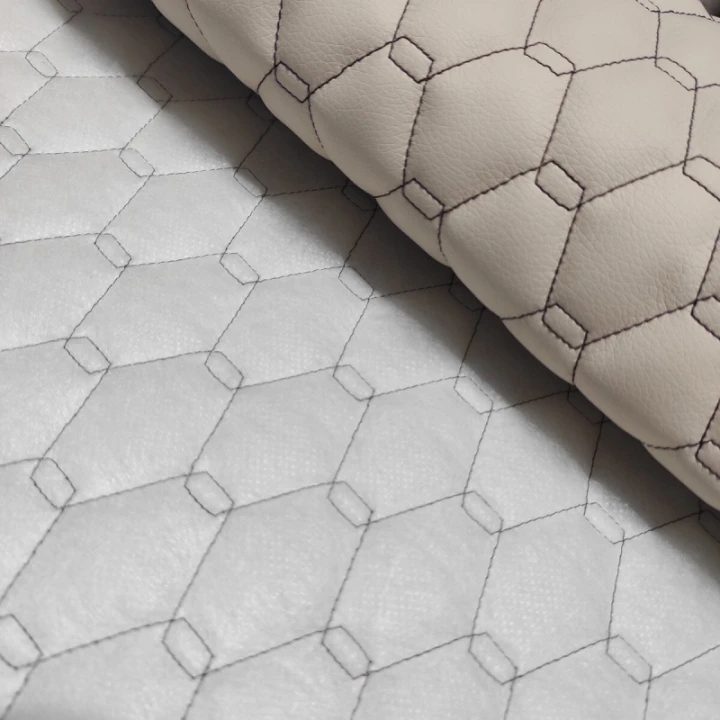 cuir-ecologique-geo-couleur-beige-cousu-avec-des-fils-marron-metrage-145-cm.jpg