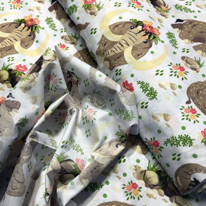 tissus-en-coton-au-m-tre-motif-mammouthssur-blanche-160-cm-444jpg1111.jpg